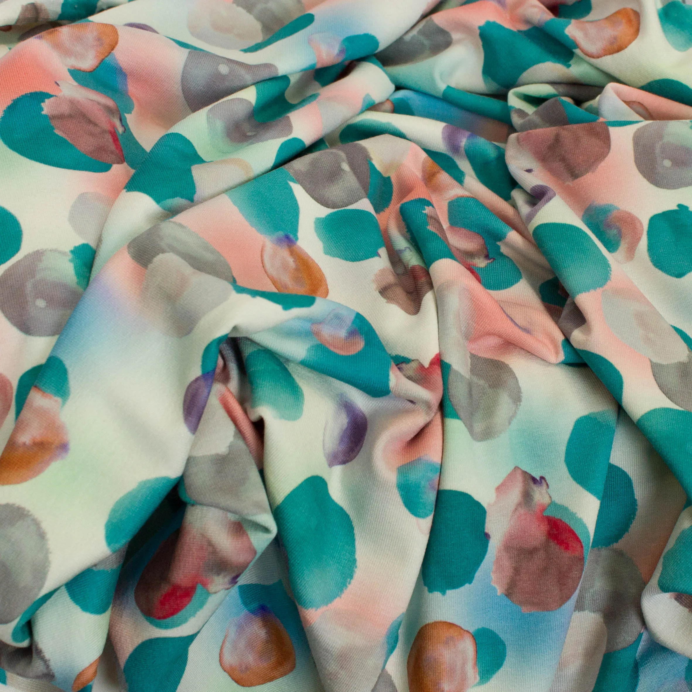Viscose tricot met digitale bollen print petrol / roze